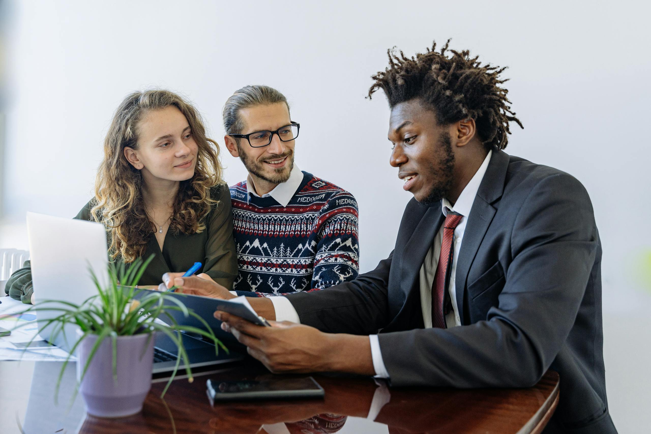 Mortgage consultant explaining finance to first time buyers