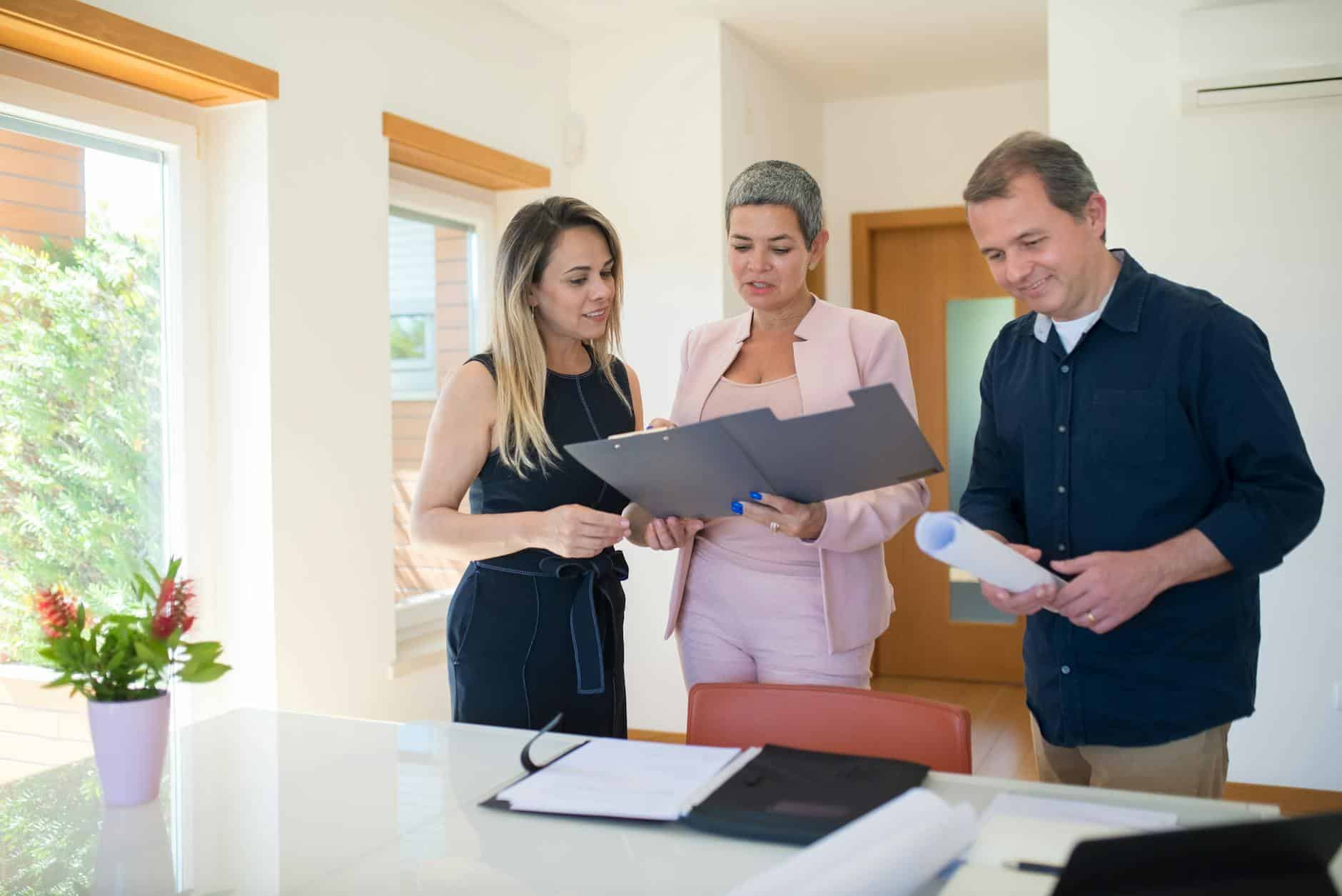 Professional FCA-registered property sourcer consulting with an investor client